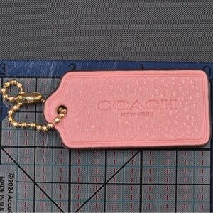 Coach Pink Hang Tag with Gold Chain tiny stain